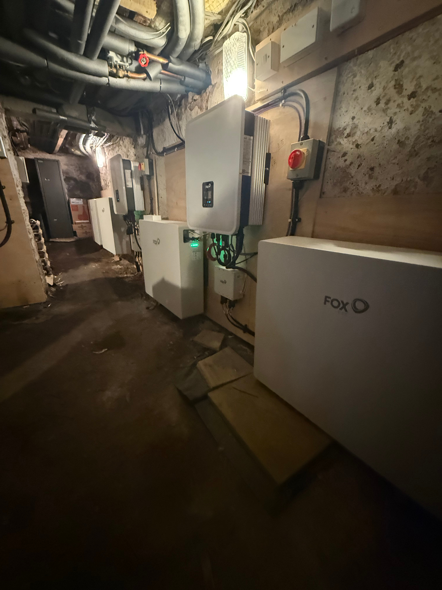 Fox ESS battery cabinets and hybrid inverter in the plant room