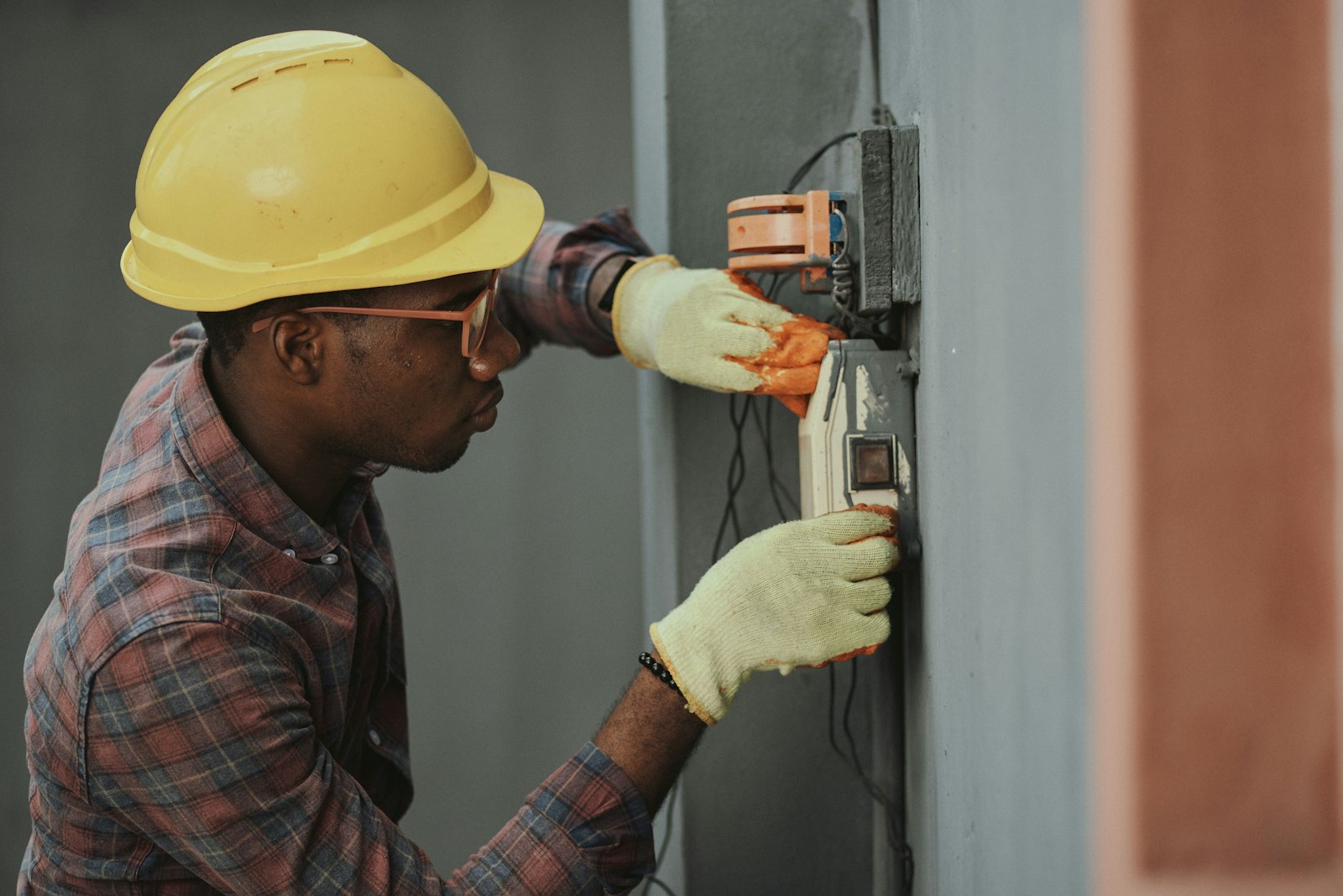 Eastern Electric engineers working on industrial control panel